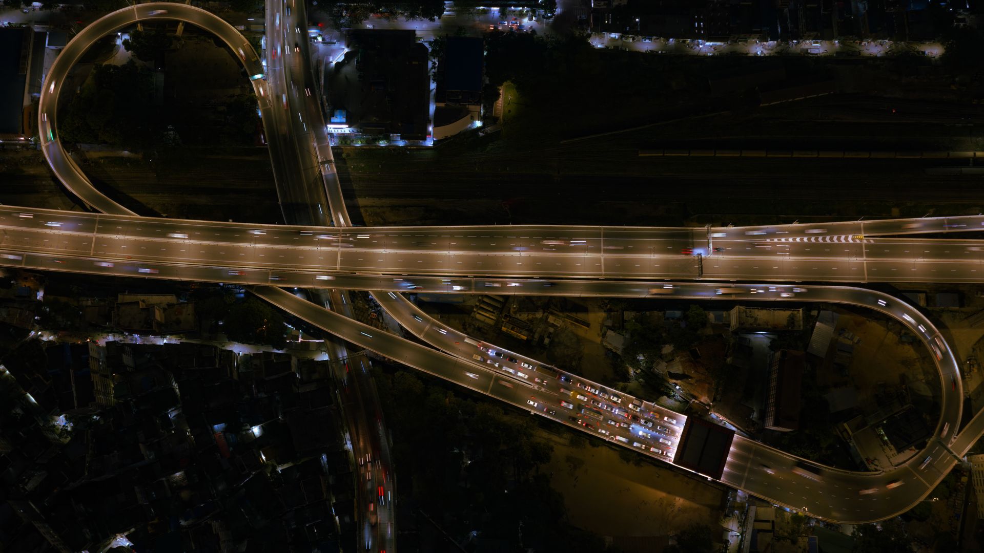 Elevated highway interchange lit up at night